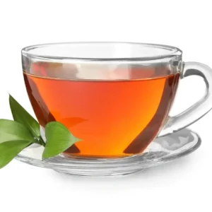 Glass cup of tea with green leaves.